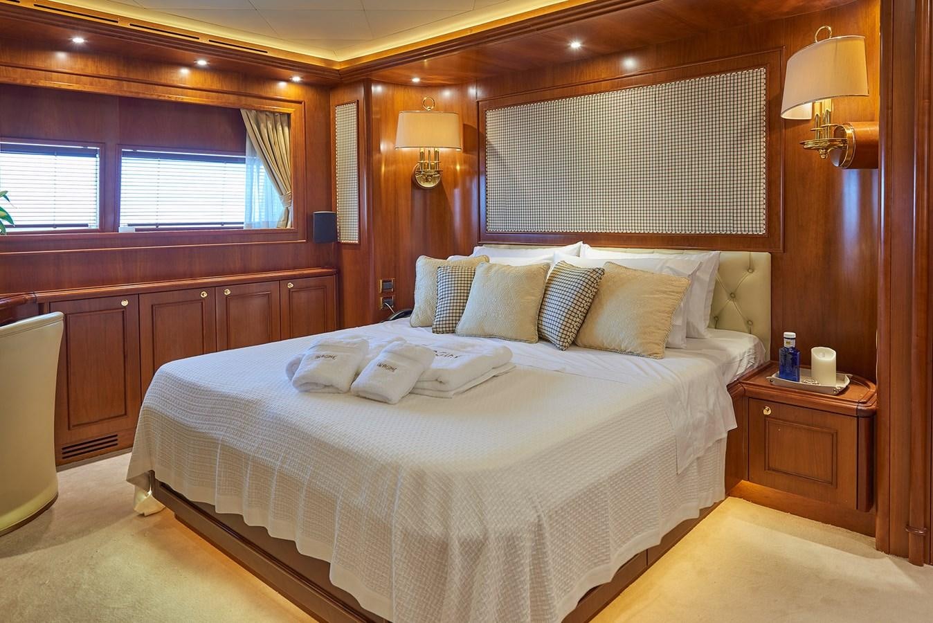 a bed in a room aboard IMAGINE Yacht for Charter