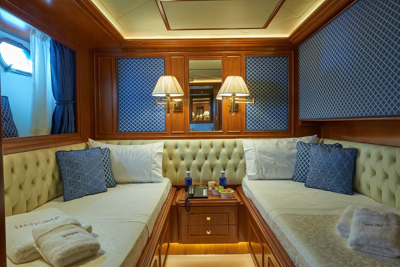 a room with two beds aboard IMAGINE Yacht for Charter