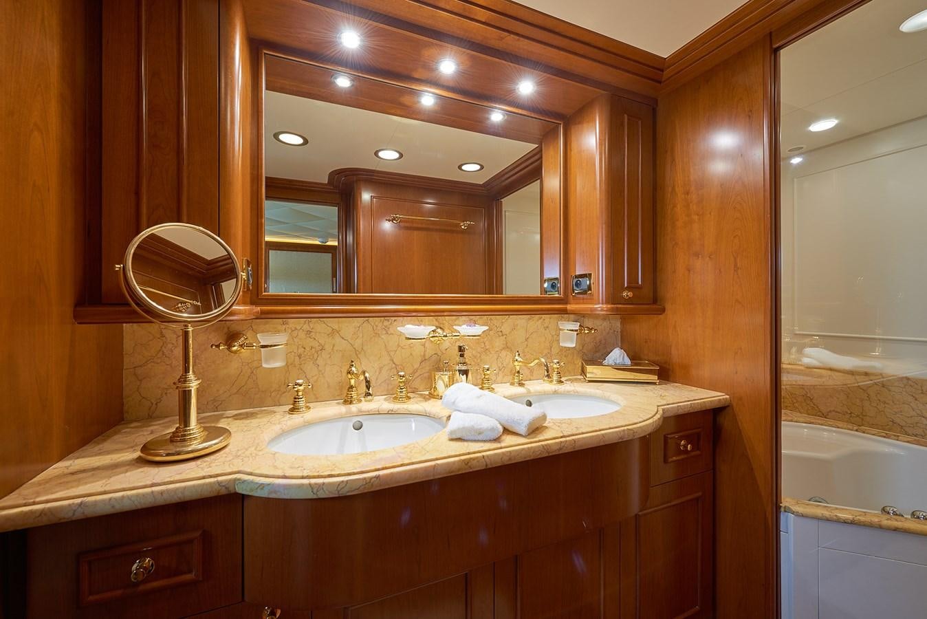 a bathroom with a large mirror aboard IMAGINE Yacht for Charter