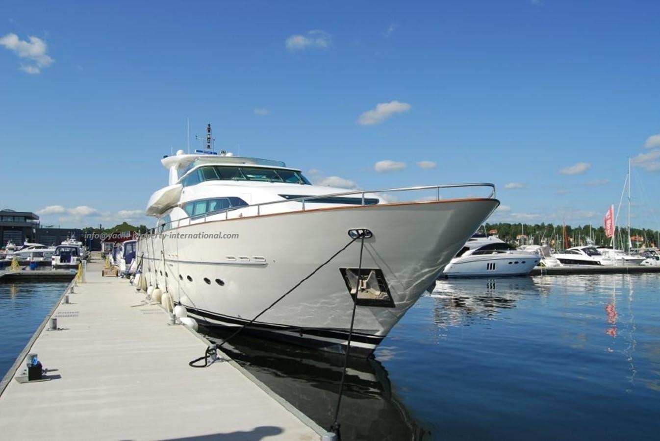 a white yacht docked at a dock aboard AZIMUT STYLE Yacht for Sale