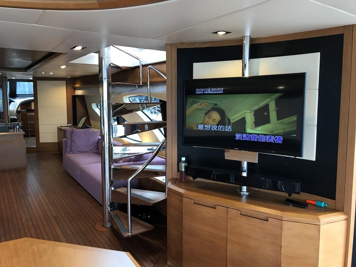 a tv on a stand in a room aboard AZIMUT 98/38 Yacht for Sale