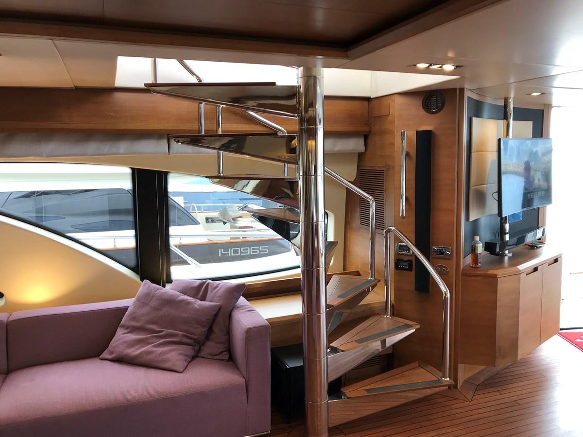 a room with a bed and a tv aboard AZIMUT 98/38 Yacht for Sale