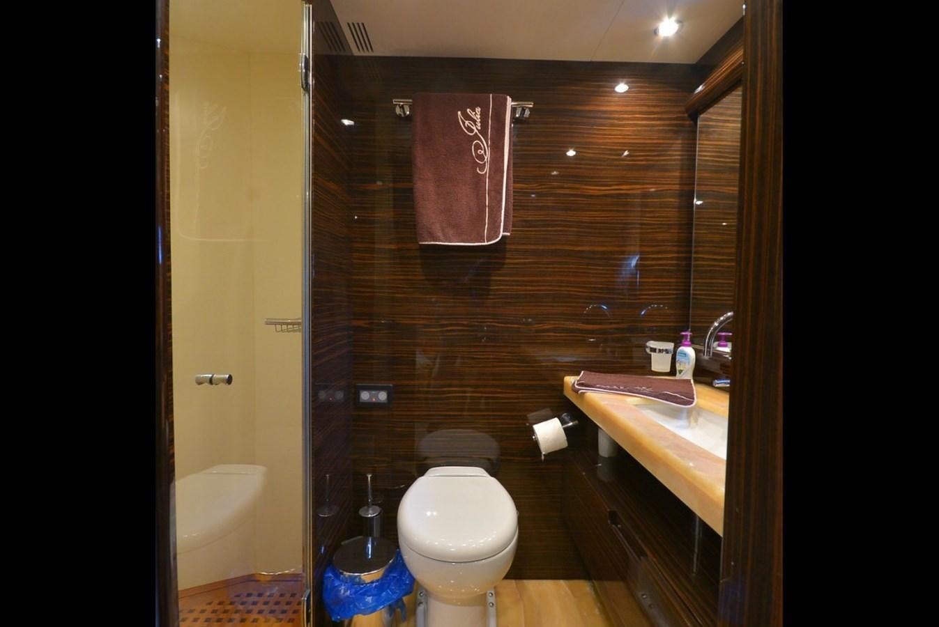 a bathroom with a toilet and sink aboard JULIA DOROTHY Yacht for Sale