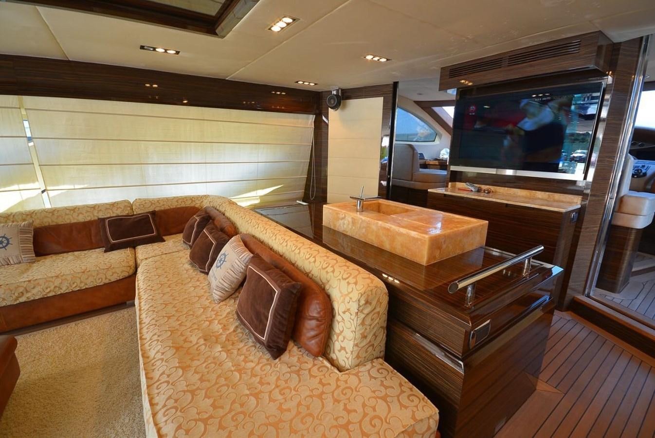 a living room with a couch and a tv aboard JULIA DOROTHY Yacht for Sale