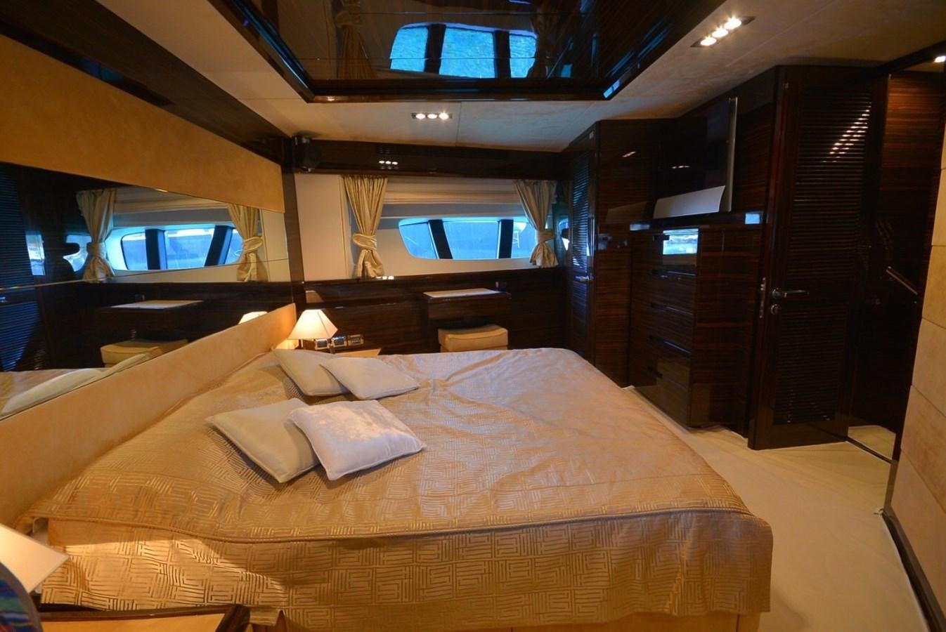 a room with a bed and a window aboard JULIA DOROTHY Yacht for Sale
