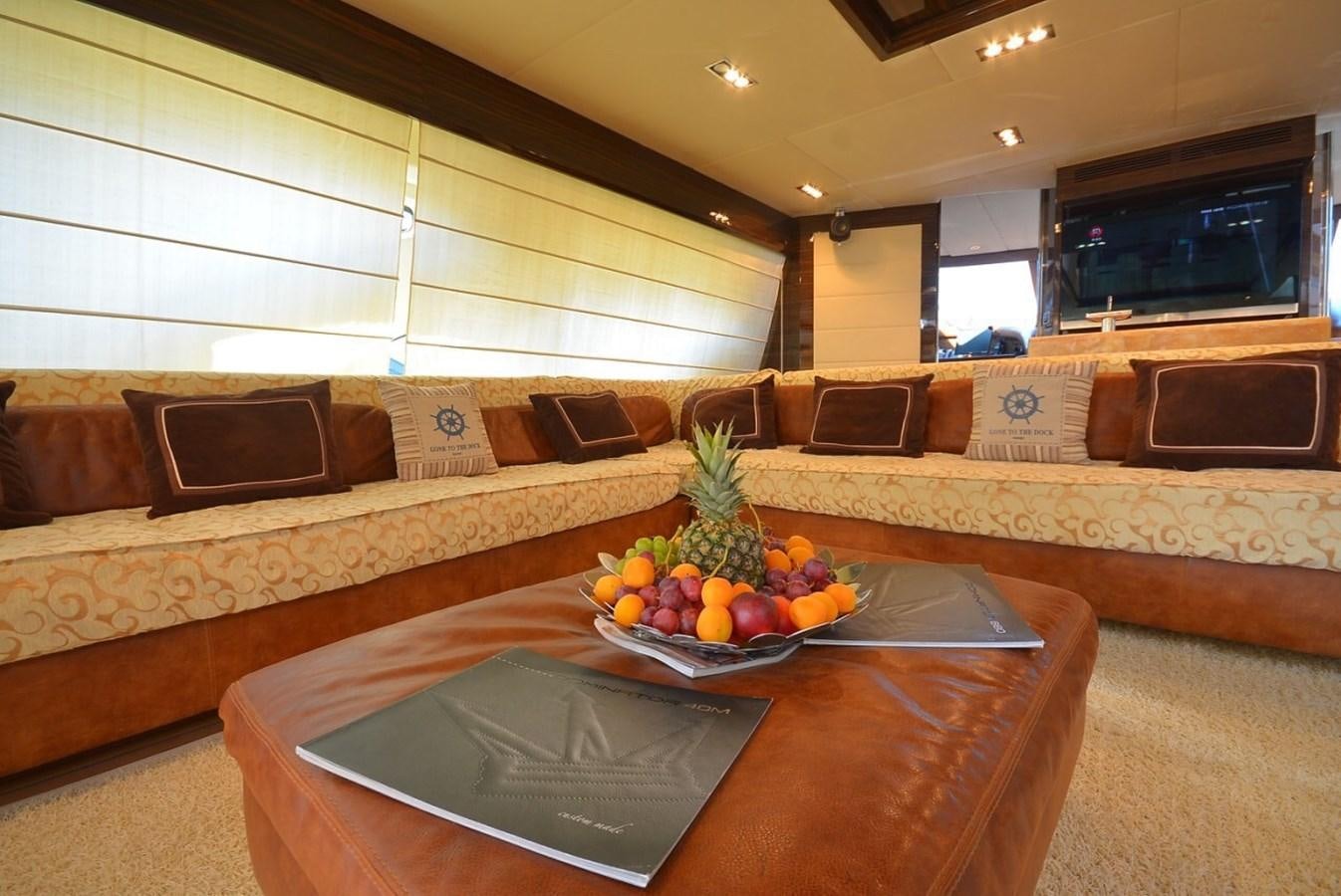 a bowl of fruit on a table in a living room aboard JULIA DOROTHY Yacht for Sale
