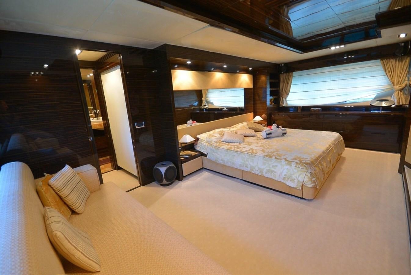 a room with a bed and a large window aboard JULIA DOROTHY Yacht for Sale