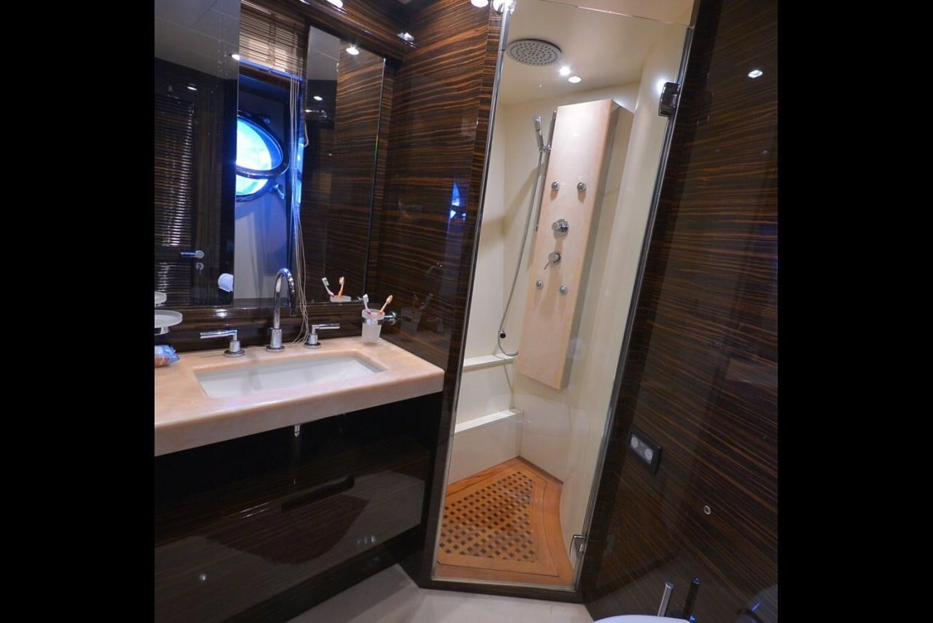 a bathroom with a sink and a mirror aboard JULIA DOROTHY Yacht for Sale