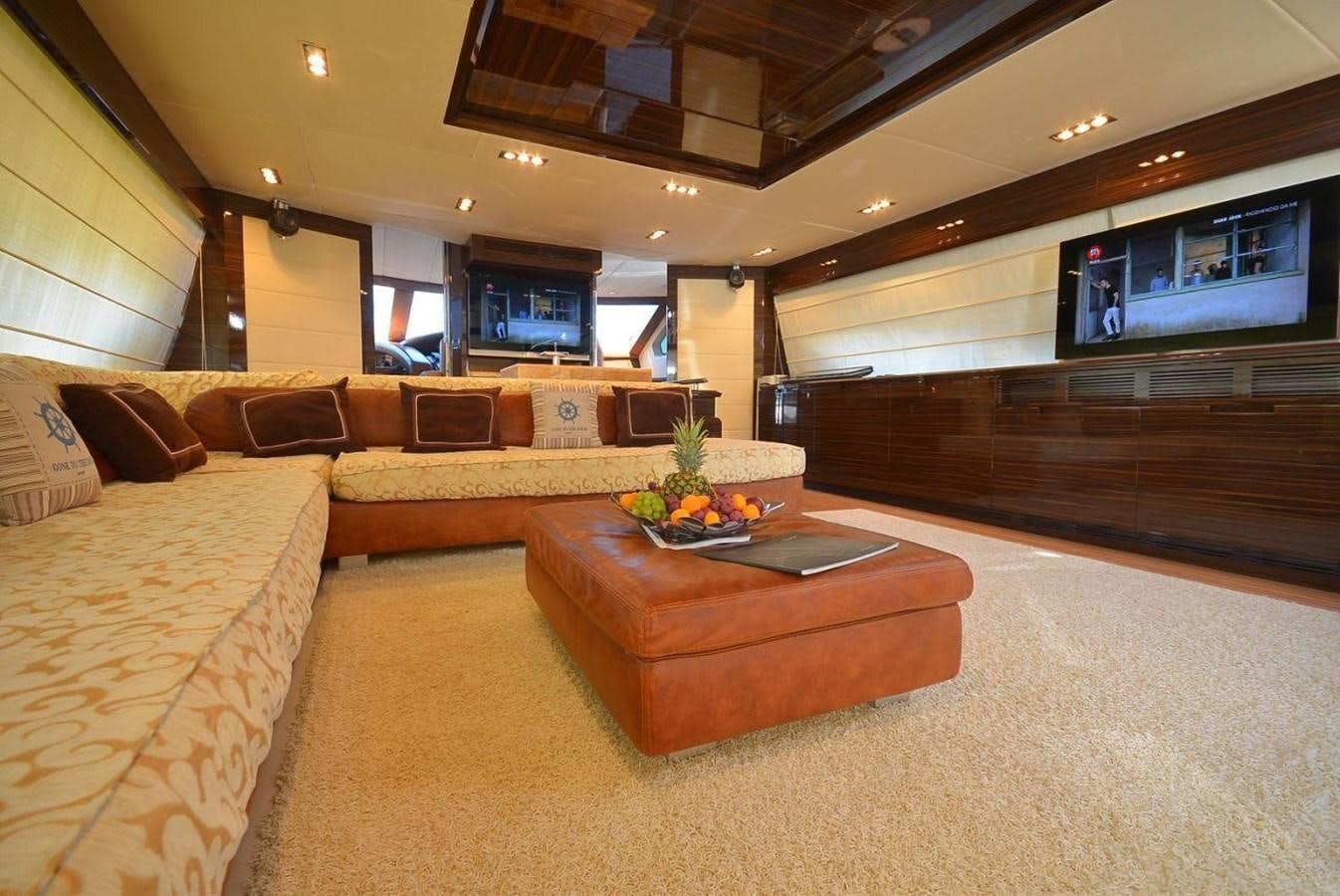 a room with a couch and a tv aboard JULIA DOROTHY Yacht for Sale