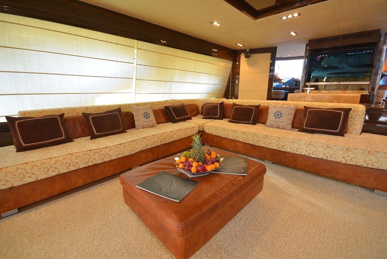 a living room with a couch and a coffee table aboard JULIA DOROTHY Yacht for Sale