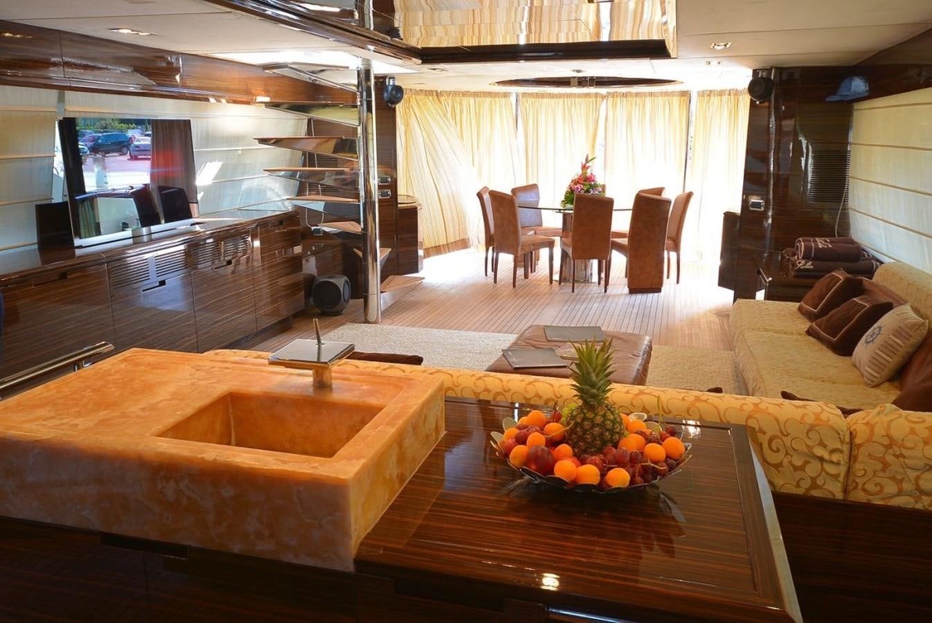 a room with a table and chairs aboard JULIA DOROTHY Yacht for Sale