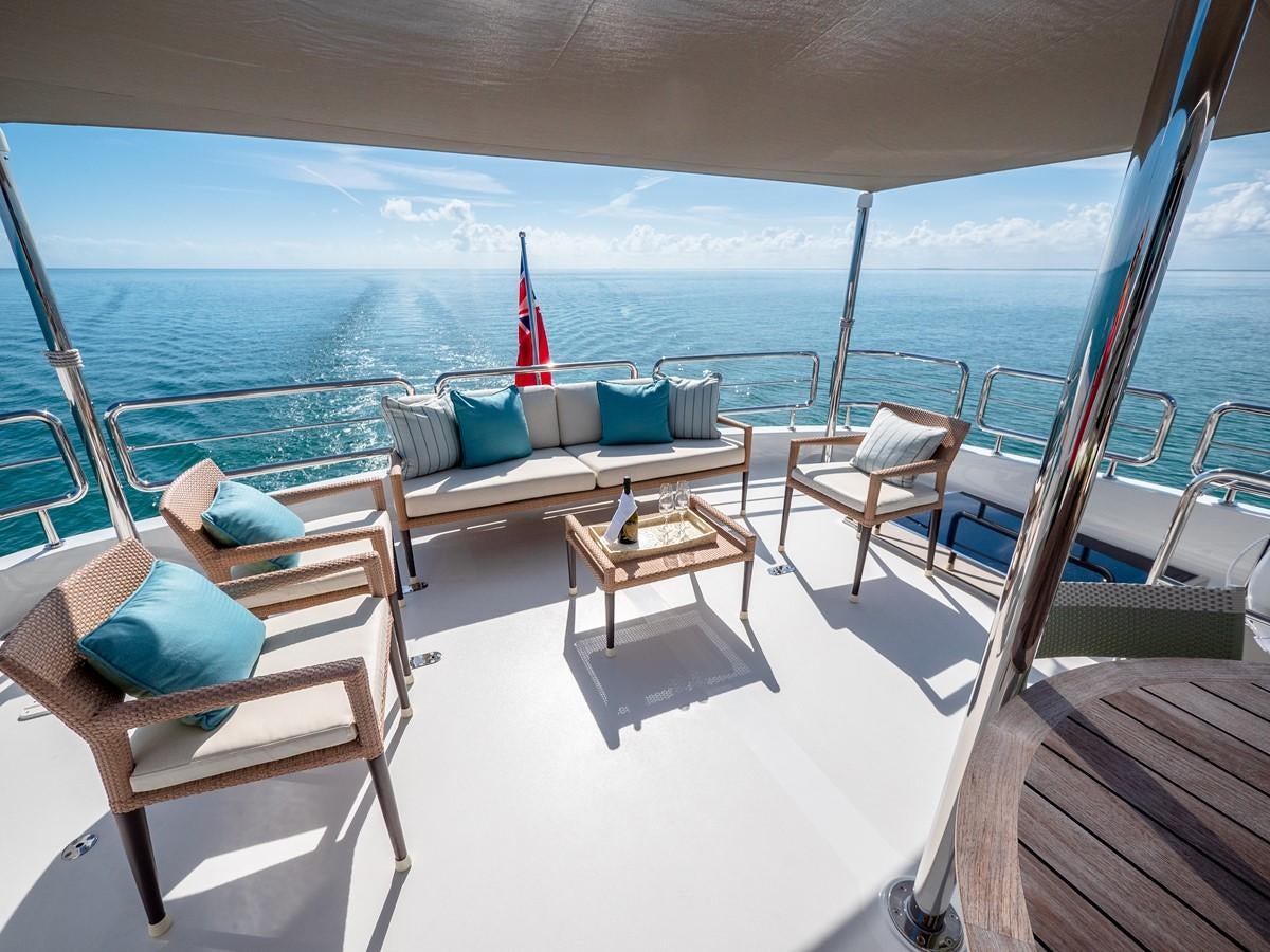 a deck with chairs and a table on it aboard SEA N SEA Yacht for Charter