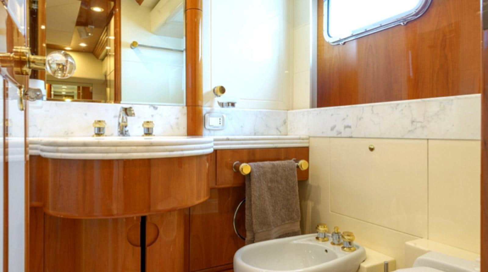 a bathroom with a sink and a mirror aboard NOVELA Yacht for Charter