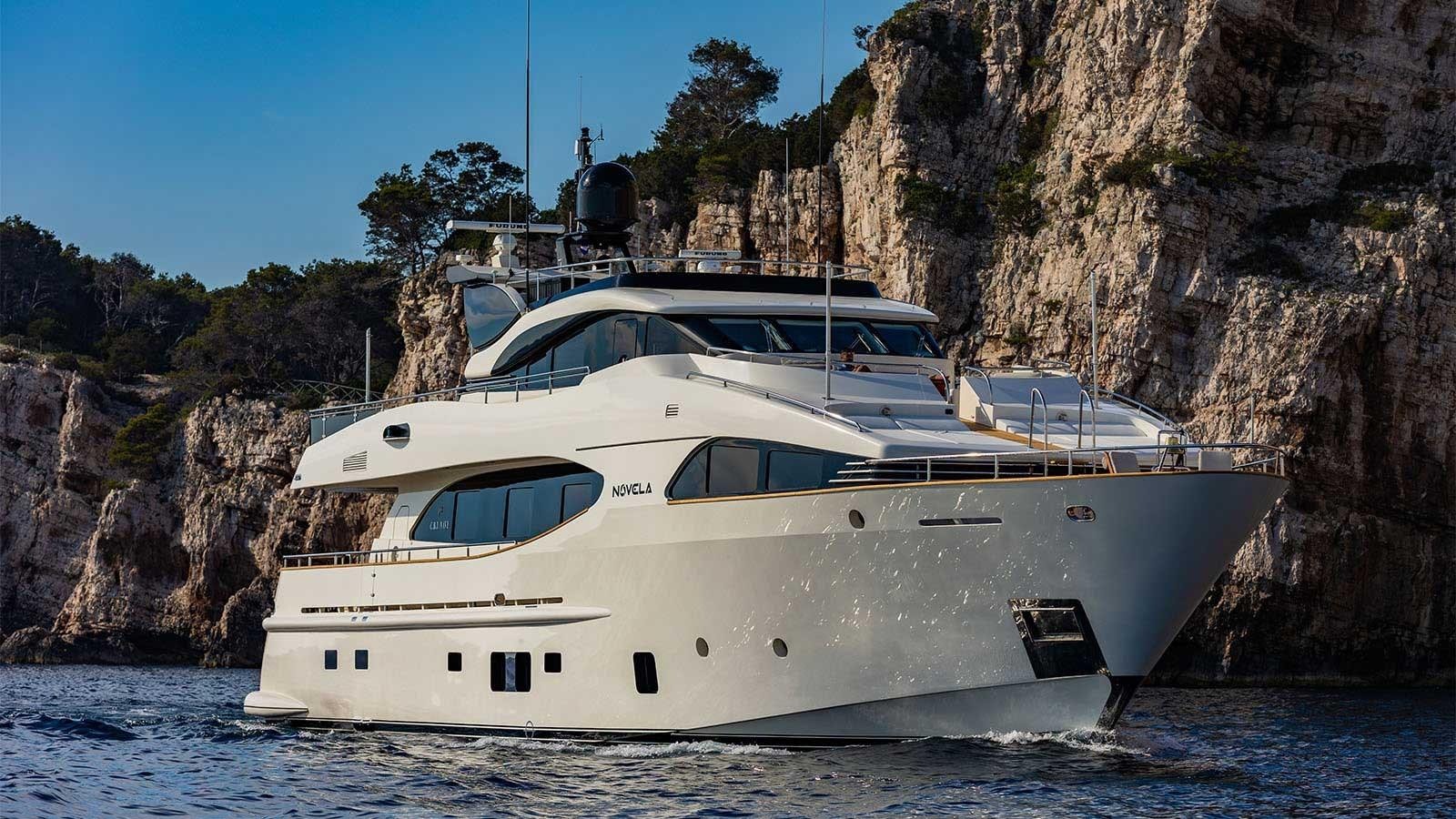 a white yacht in the water aboard NOVELA Yacht for Sale
