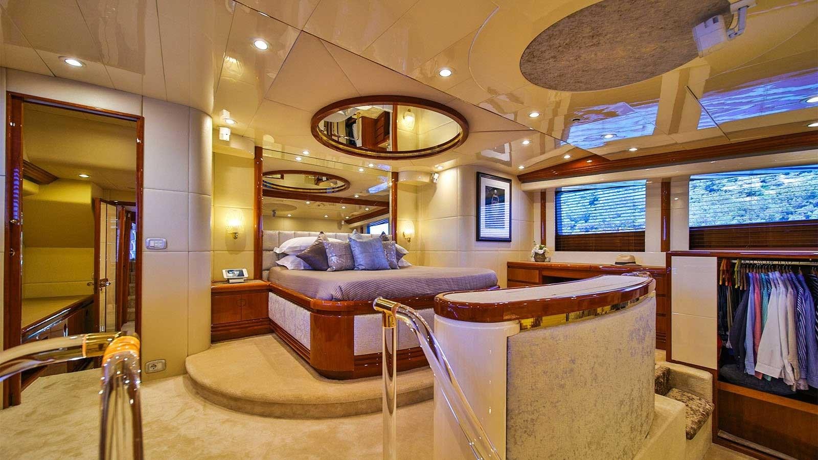 a room with a couch and a bed aboard NOVELA Yacht for Sale