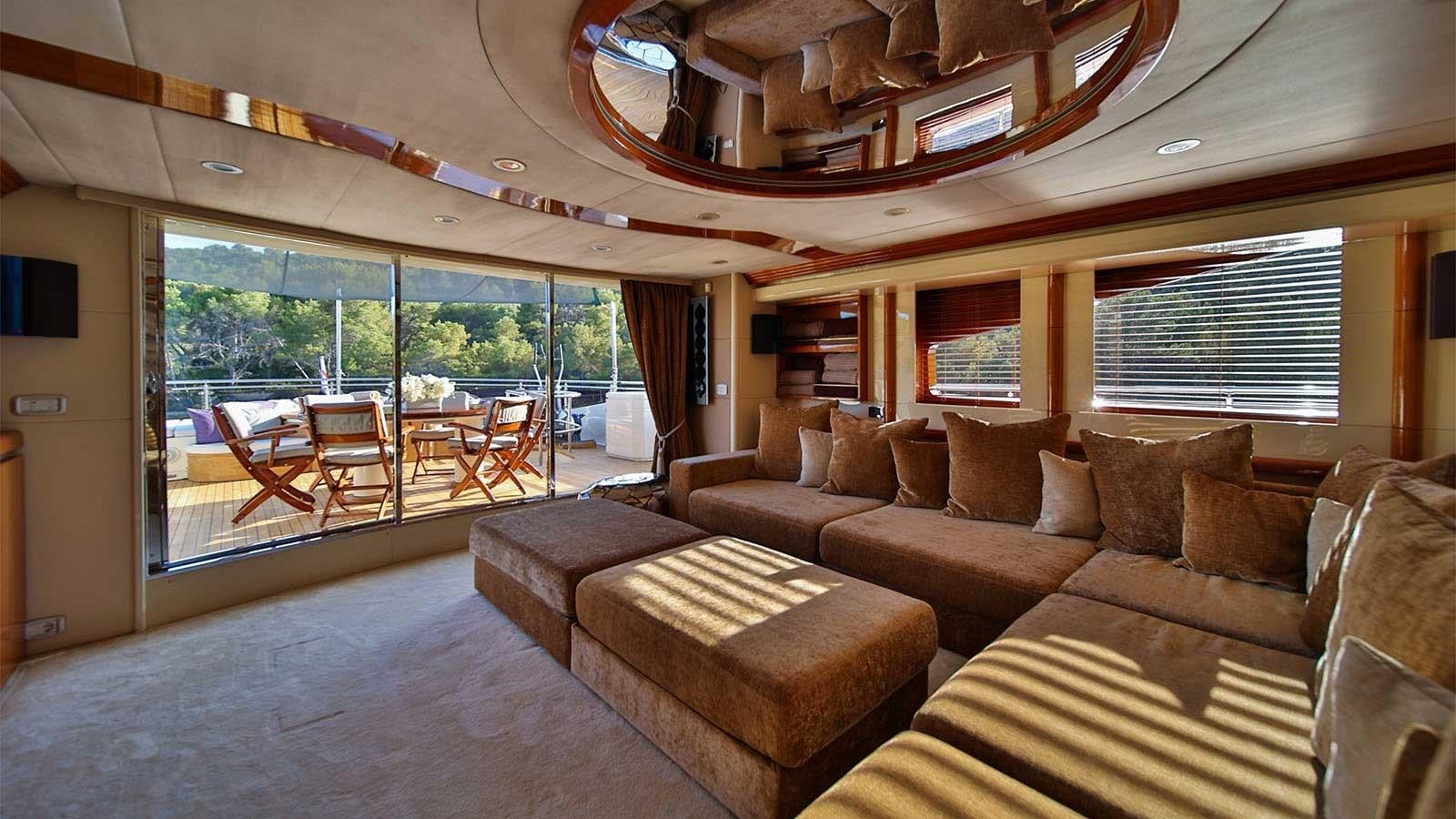 a living room with a large window aboard NOVELA Yacht for Sale