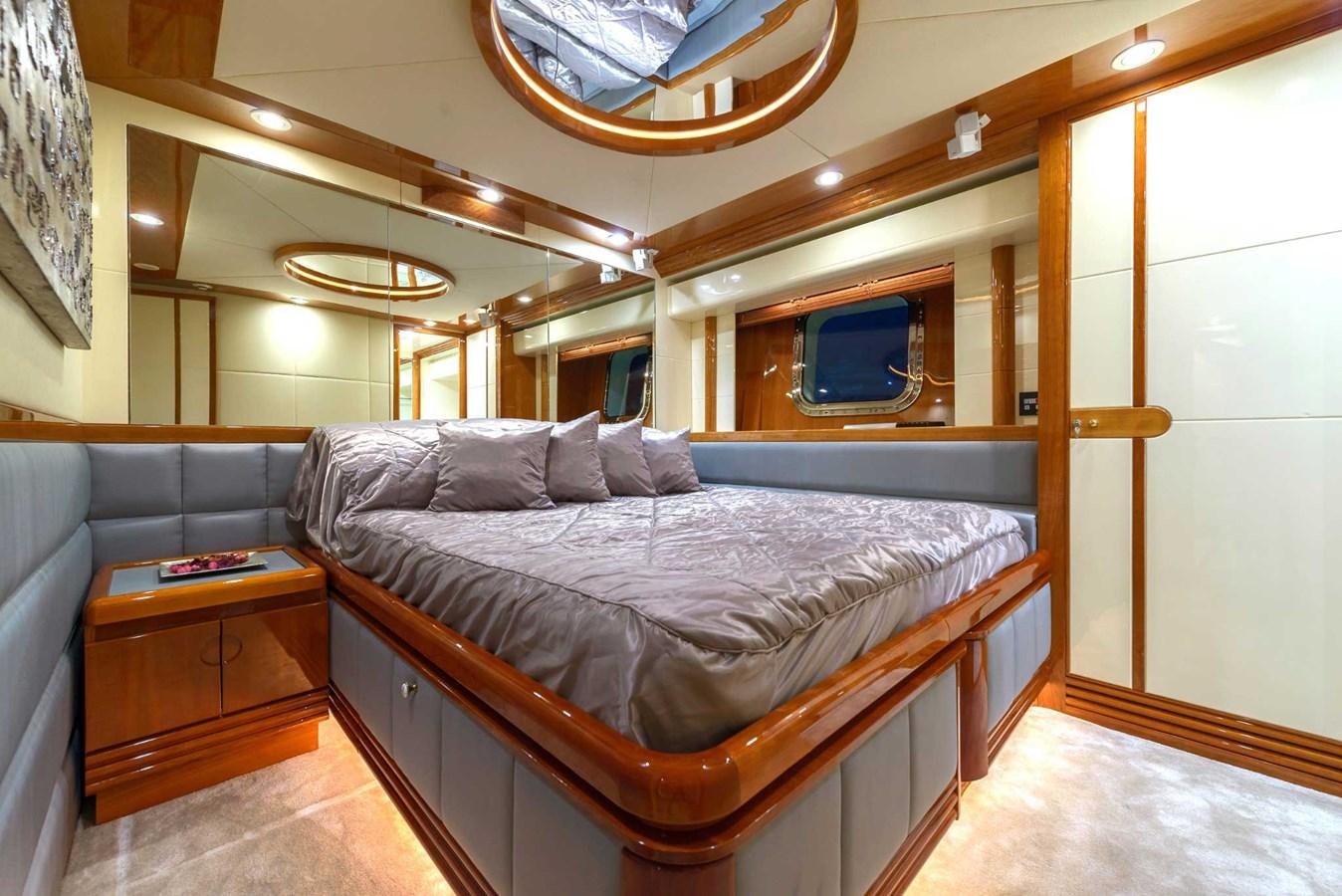a bed in a room aboard NOVELA Yacht for Sale