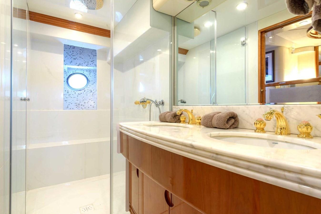a bathroom with a large mirror aboard NOVELA Yacht for Sale