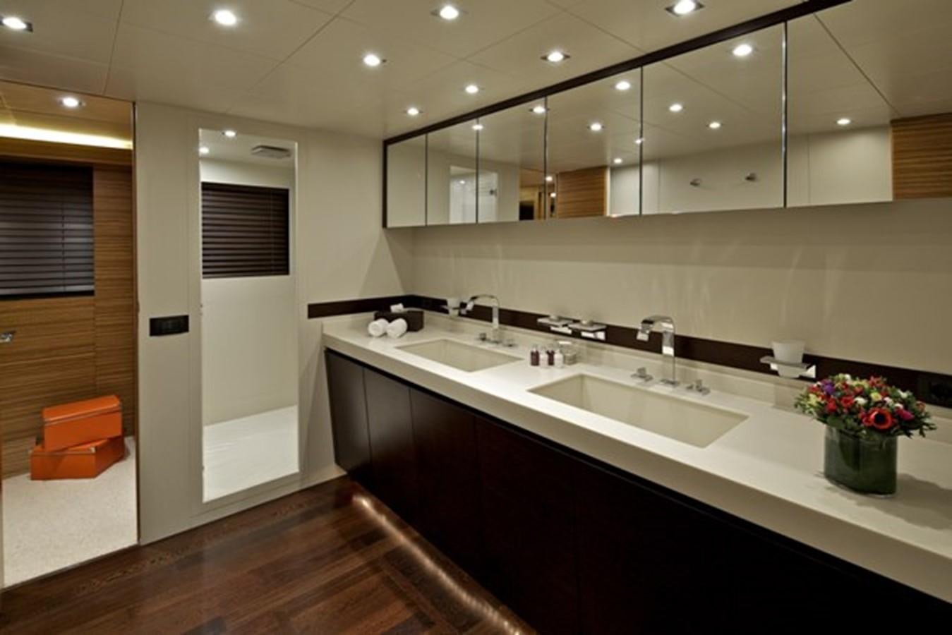 a bathroom with sinks and mirrors aboard GIOE I Yacht for Sale
