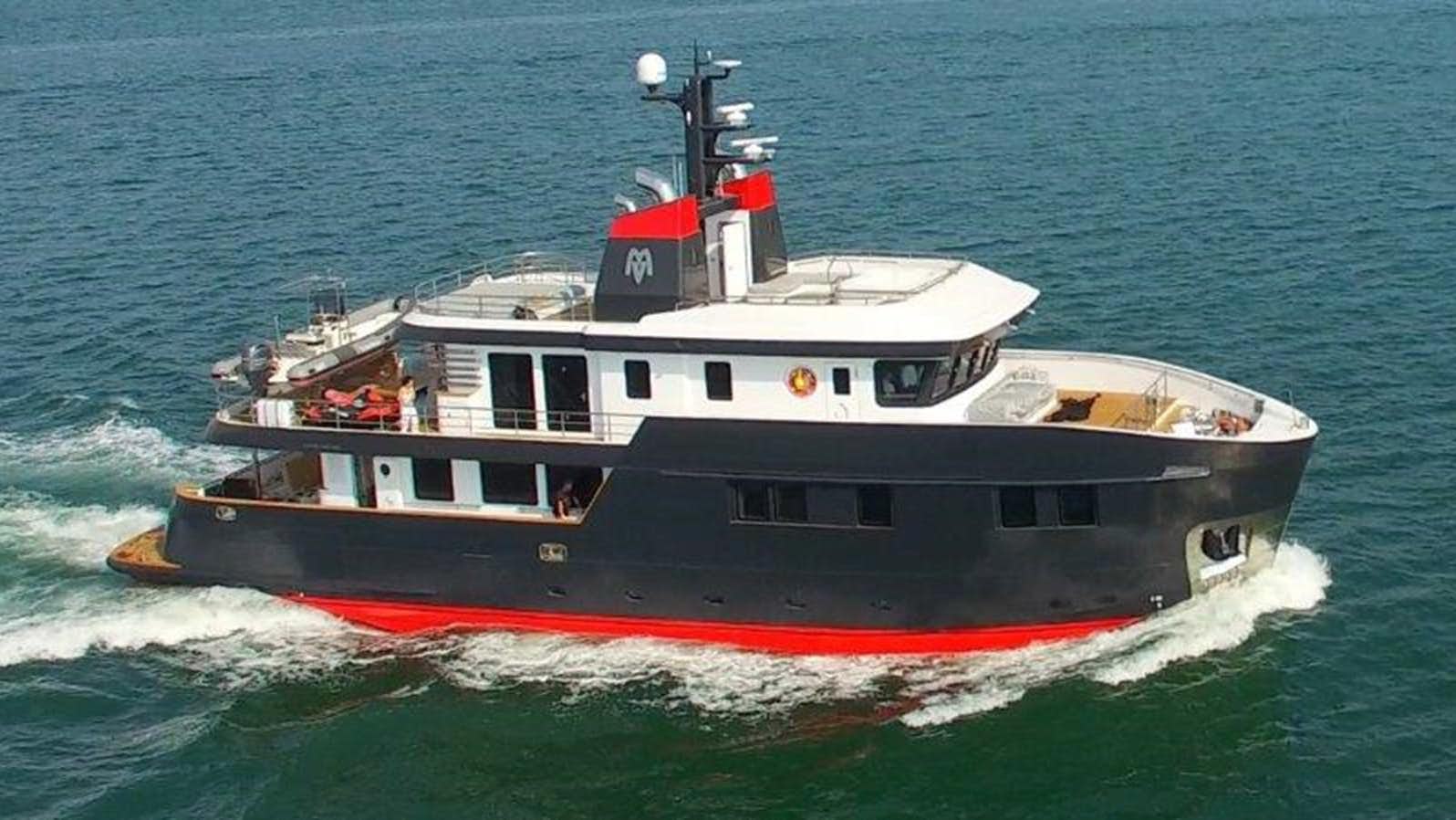 a boat on the water aboard OCEAN KING AMERICANA Yacht for Sale
