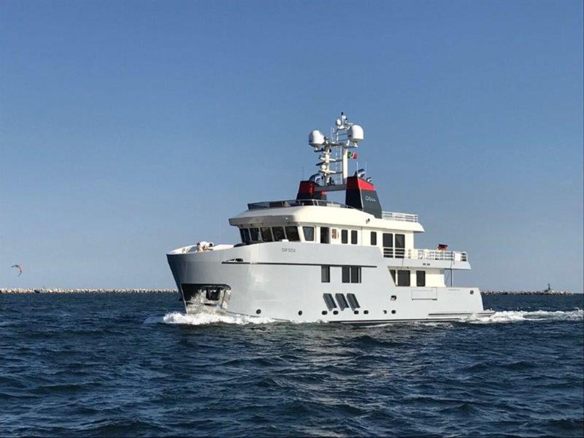 a boat in the water with Thomas Point Shoal Light in the background aboard OCEAN KING AMERICANA Yacht for Sale