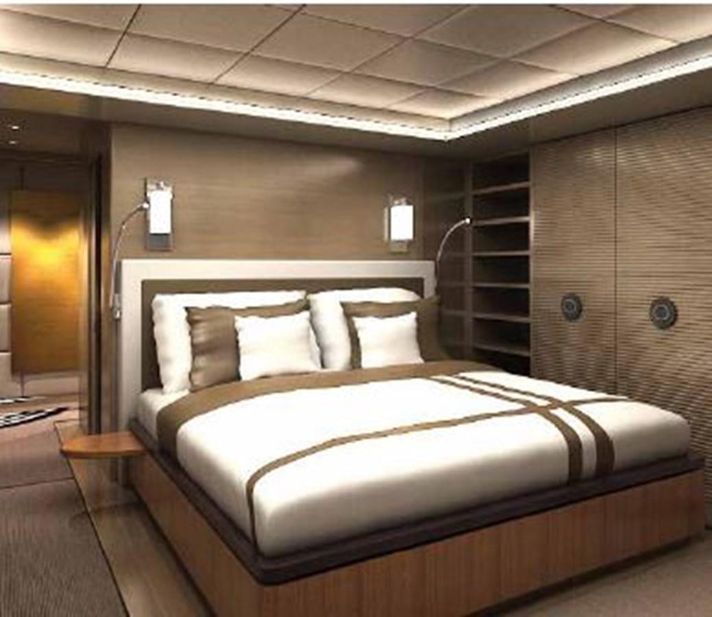 a bed in a room aboard OCEAN KING AMERICANA Yacht for Sale