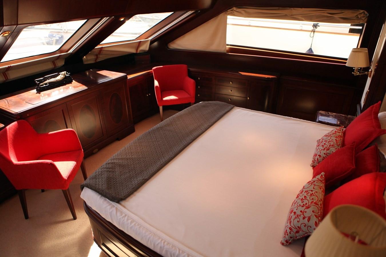 a room with a bed and a chair aboard ANYPA Yacht for Sale