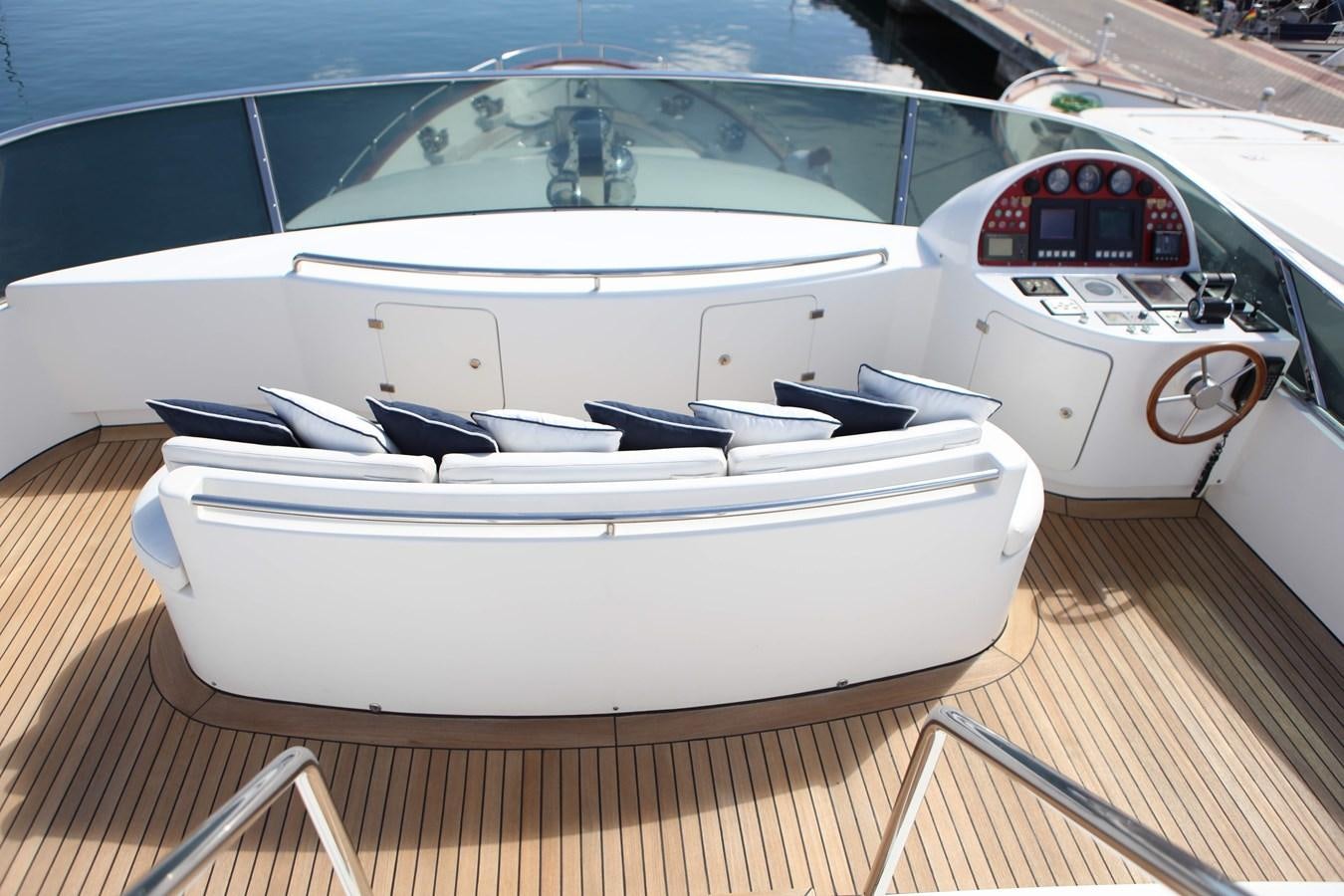 a white boat on a wooden deck aboard ANYPA Yacht for Sale