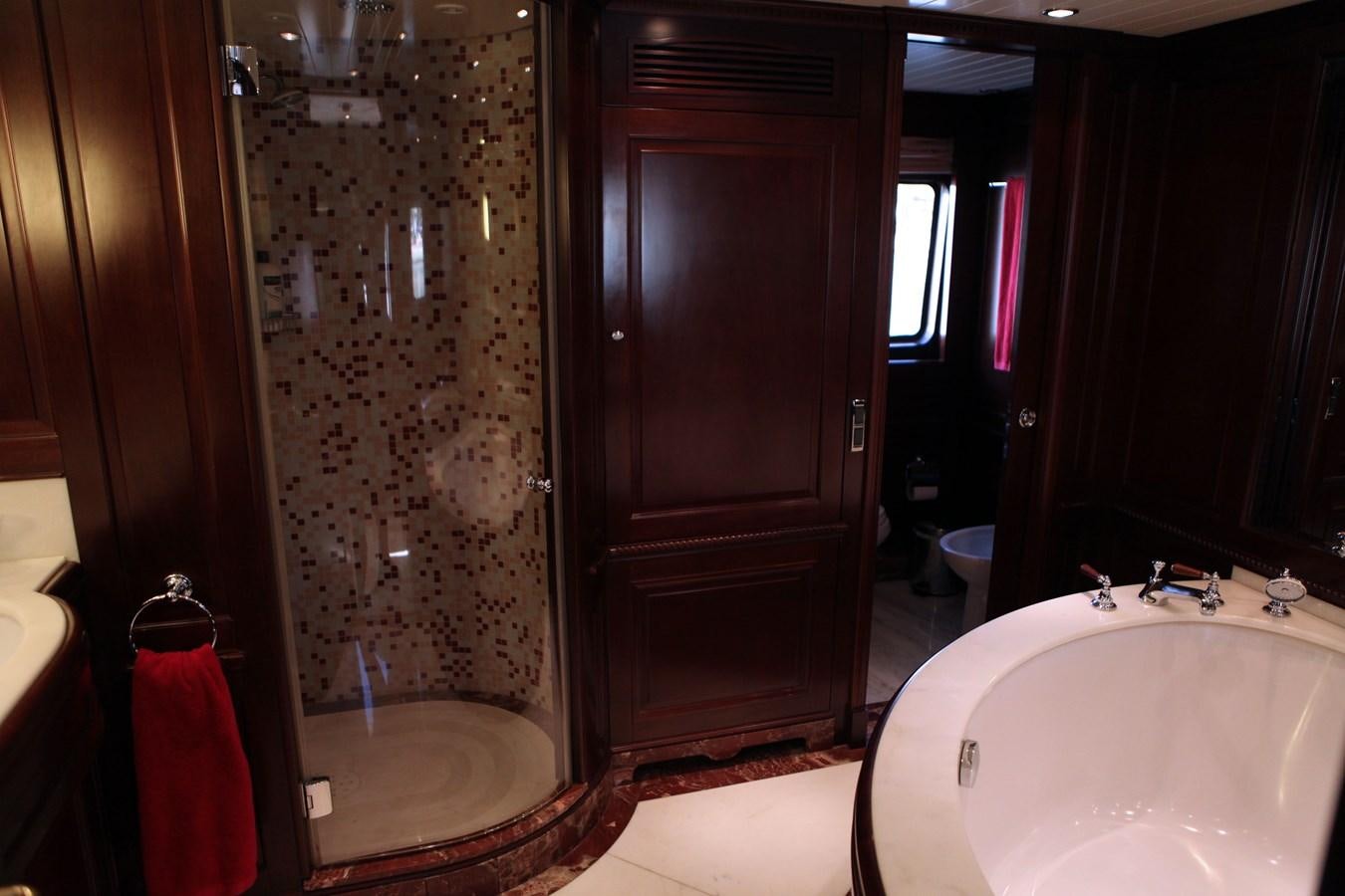 a bathroom with a bathtub and shower aboard ANYPA Yacht for Sale