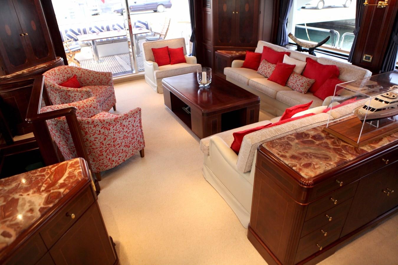 a living room with a couch and a coffee table aboard ANYPA Yacht for Sale