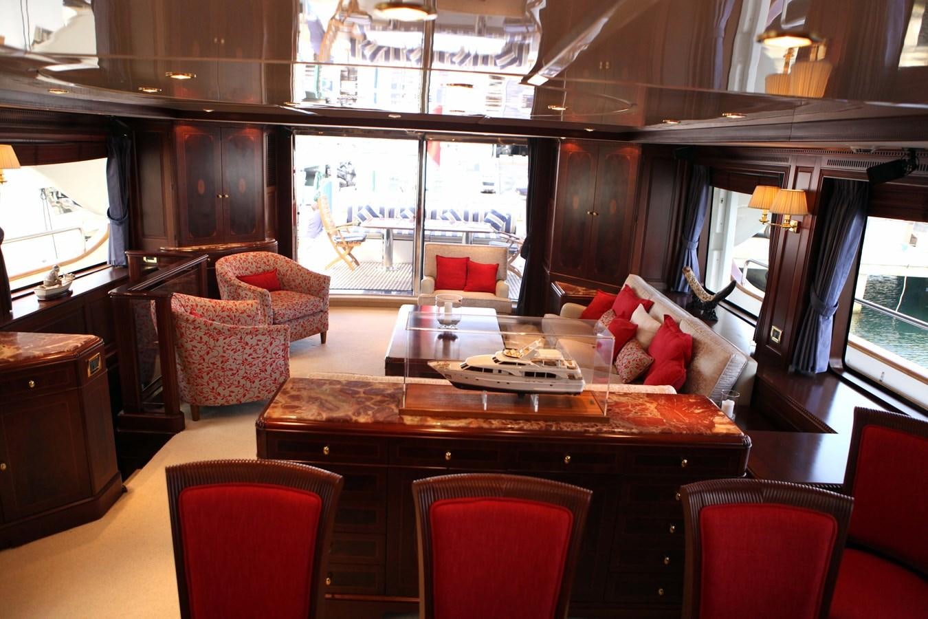 a room with a table chairs and a couch aboard ANYPA Yacht for Sale