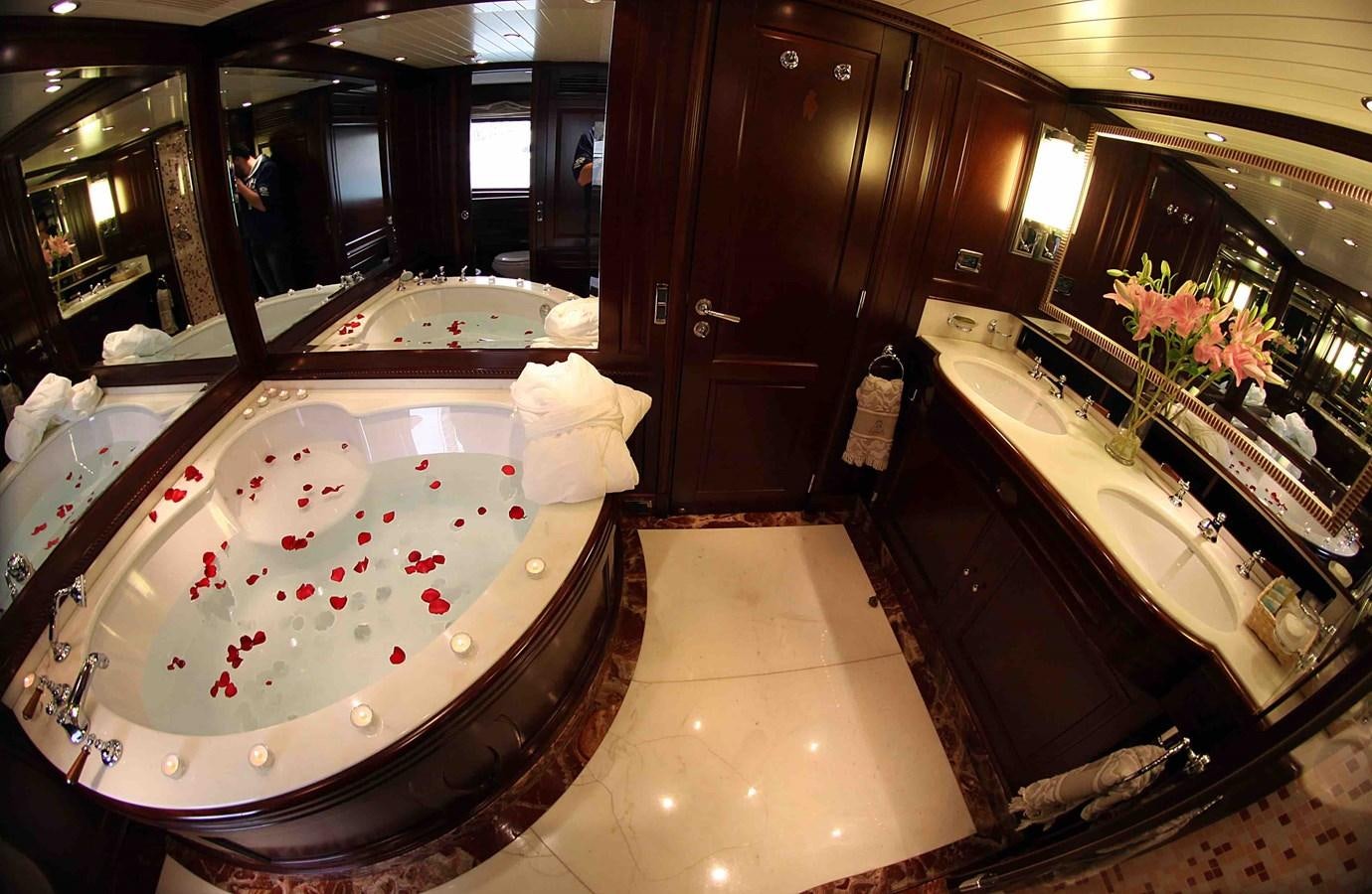 a bathroom with a tub and sinks aboard ANYPA Yacht for Sale