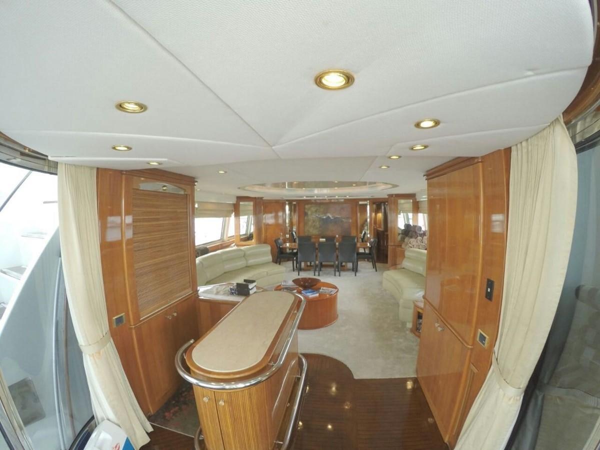 a room with a table and chairs aboard AZIMUT 100' Yacht for Sale