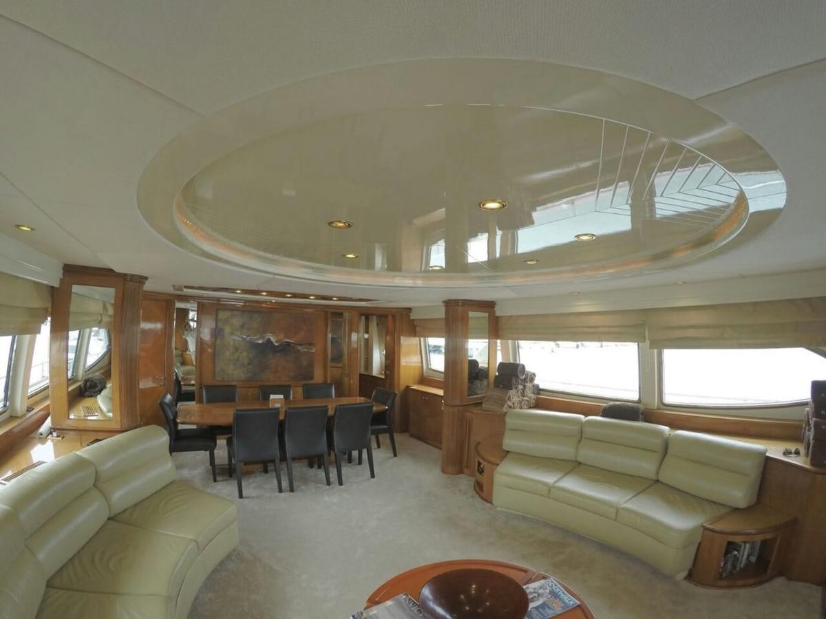 a living room with a large mirror aboard AZIMUT 100' Yacht for Sale