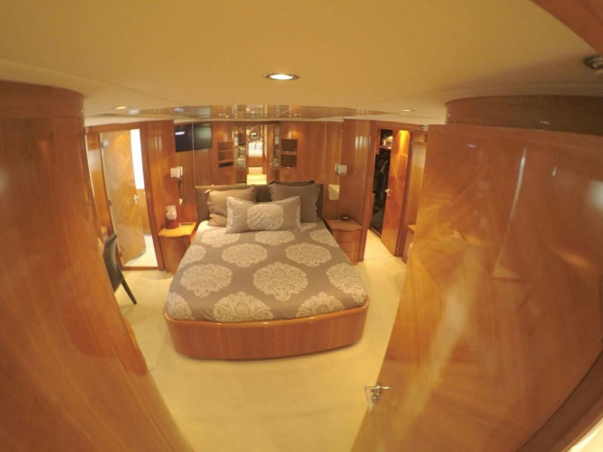 a bed in a hotel room aboard AZIMUT 100' Yacht for Sale
