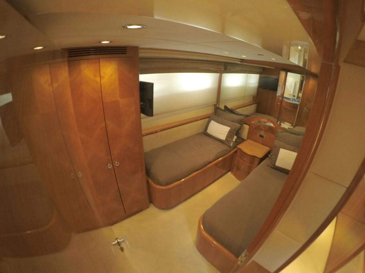 a room with a wood cabinet aboard AZIMUT 100' Yacht for Sale