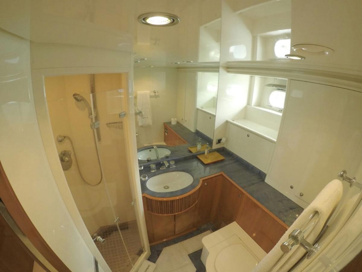 a bathroom with a sink and a shower aboard AZIMUT 100' Yacht for Sale