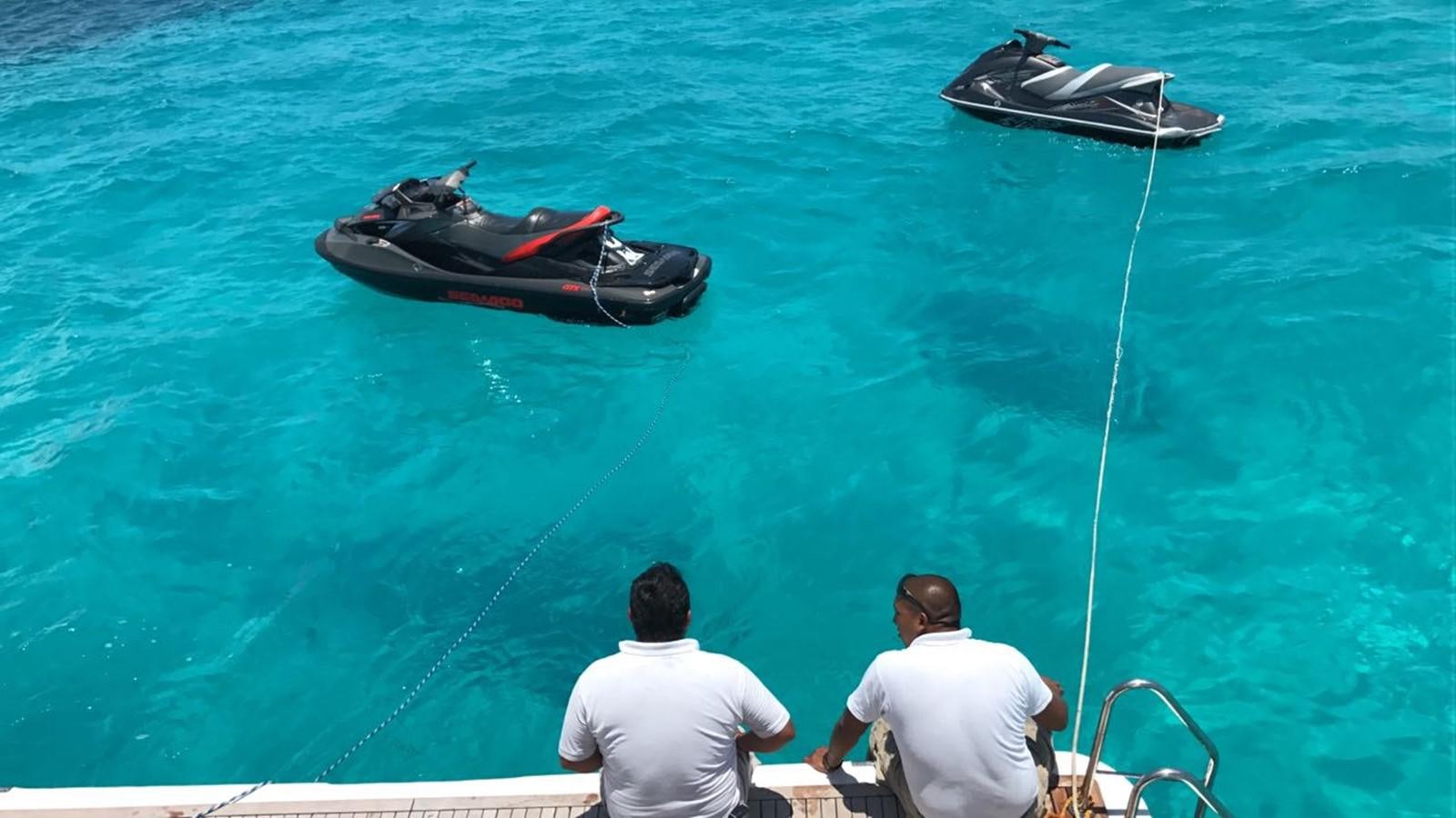 a couple of men on a boat aboard AZIMUT 100' Yacht for Sale