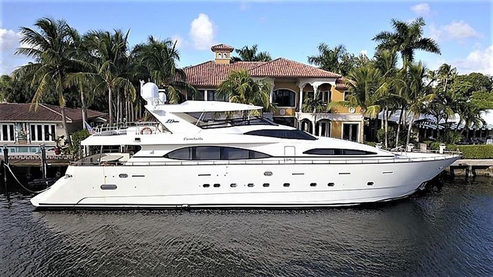 a white yacht on a dock aboard CAROBELLE Yacht for Sale
