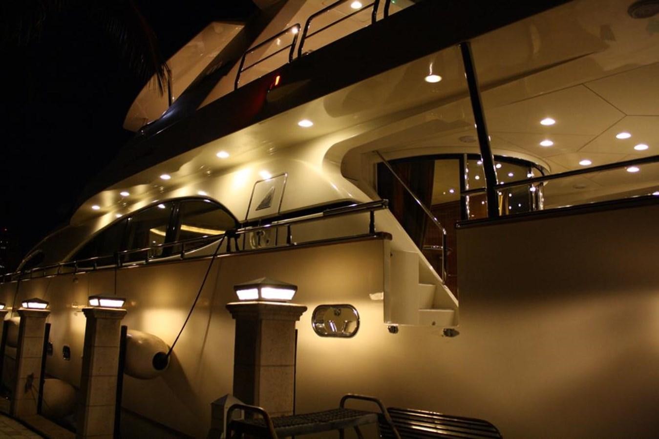 a large room with a staircase and a glass case aboard CAROBELLE Yacht for Sale