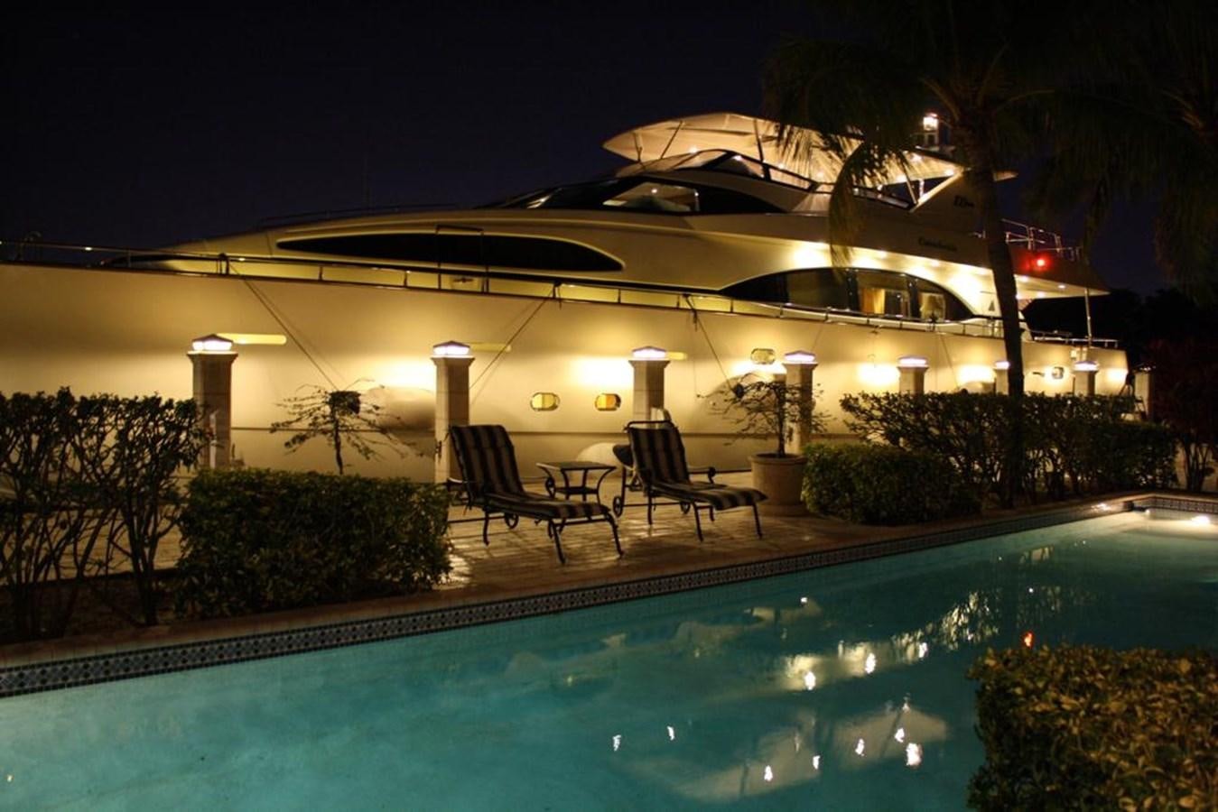 a large building with a swimming pool aboard CAROBELLE Yacht for Sale