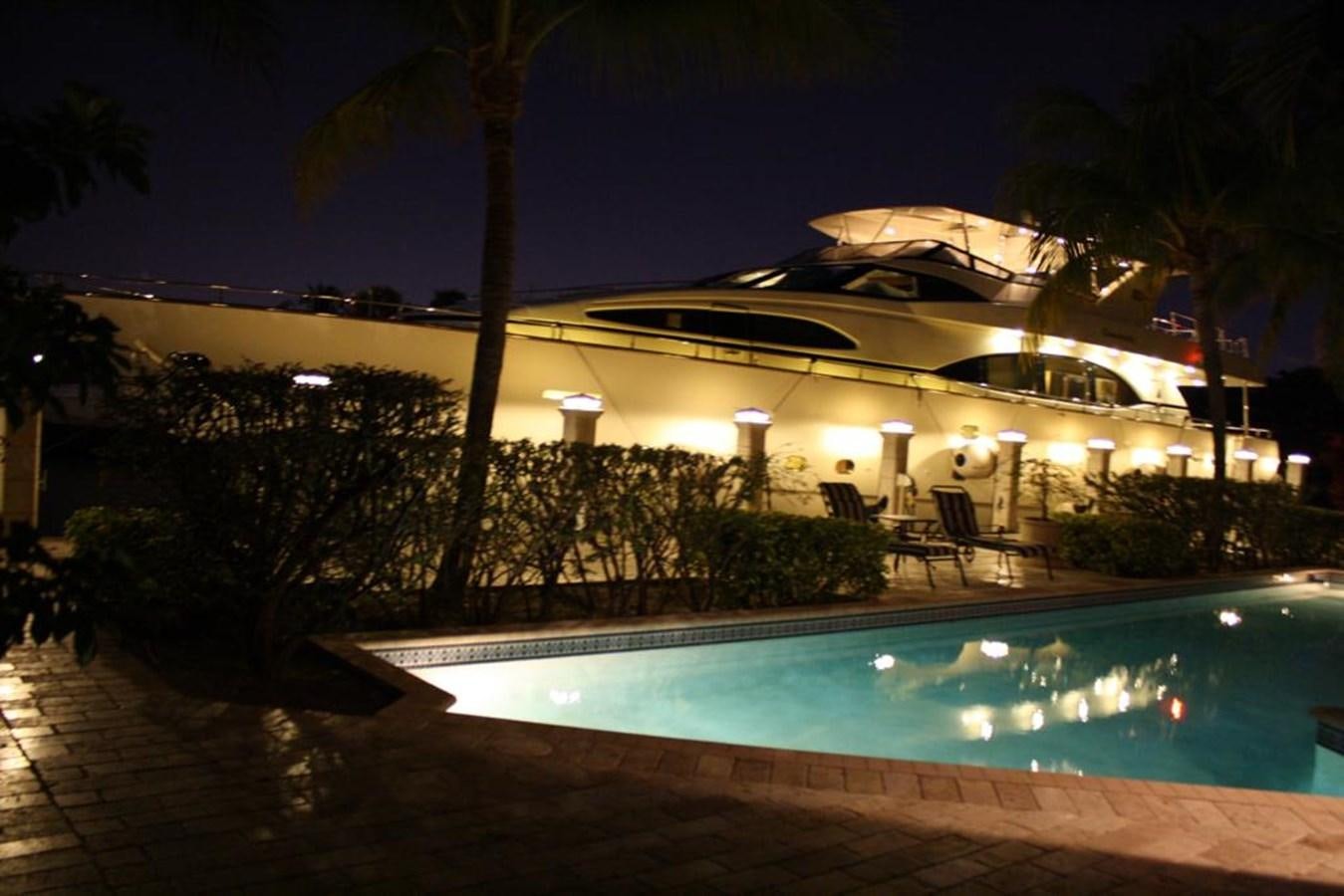 a swimming pool at night aboard CAROBELLE Yacht for Sale