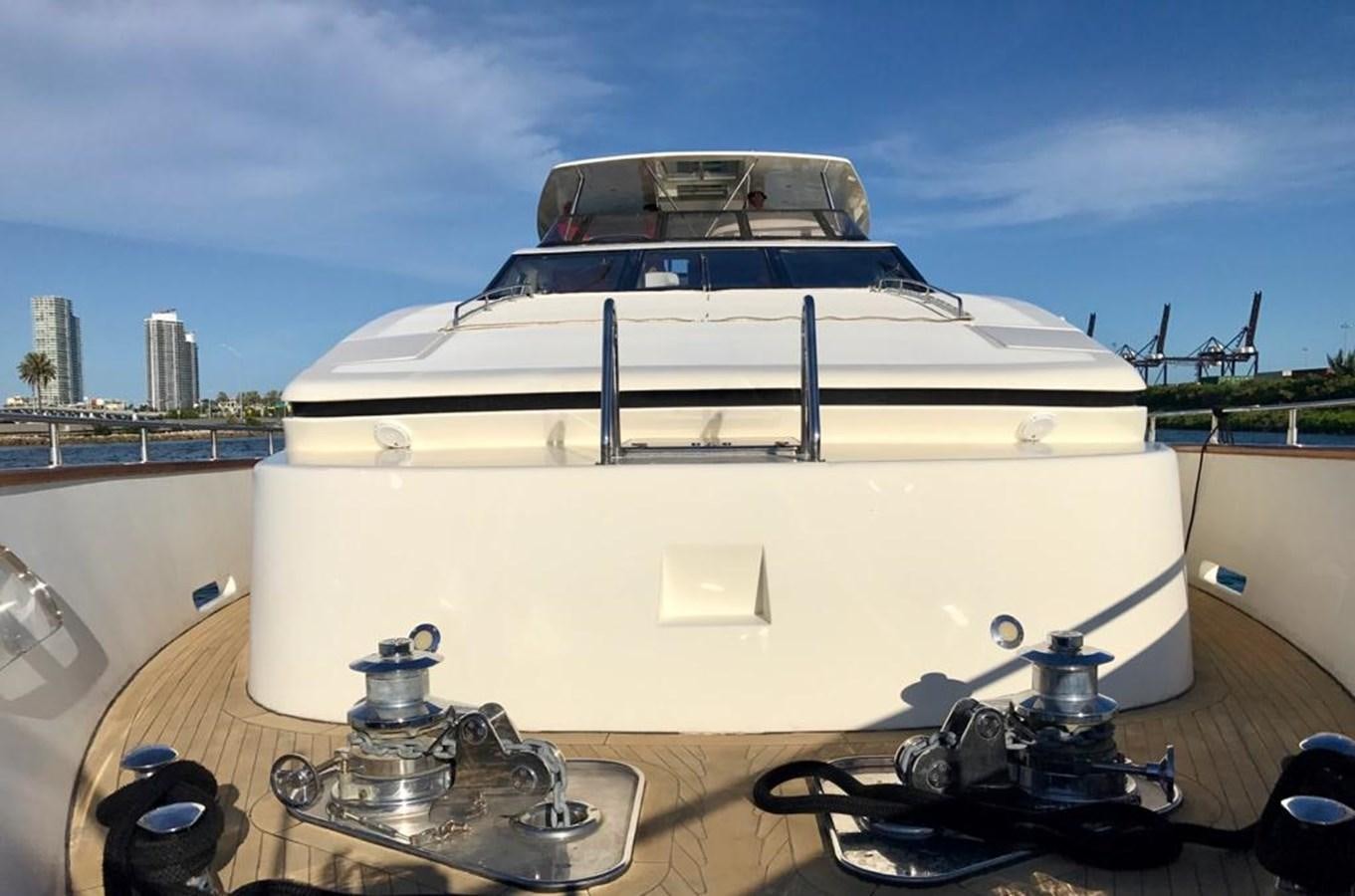 a white boat on a table aboard CAROBELLE Yacht for Sale