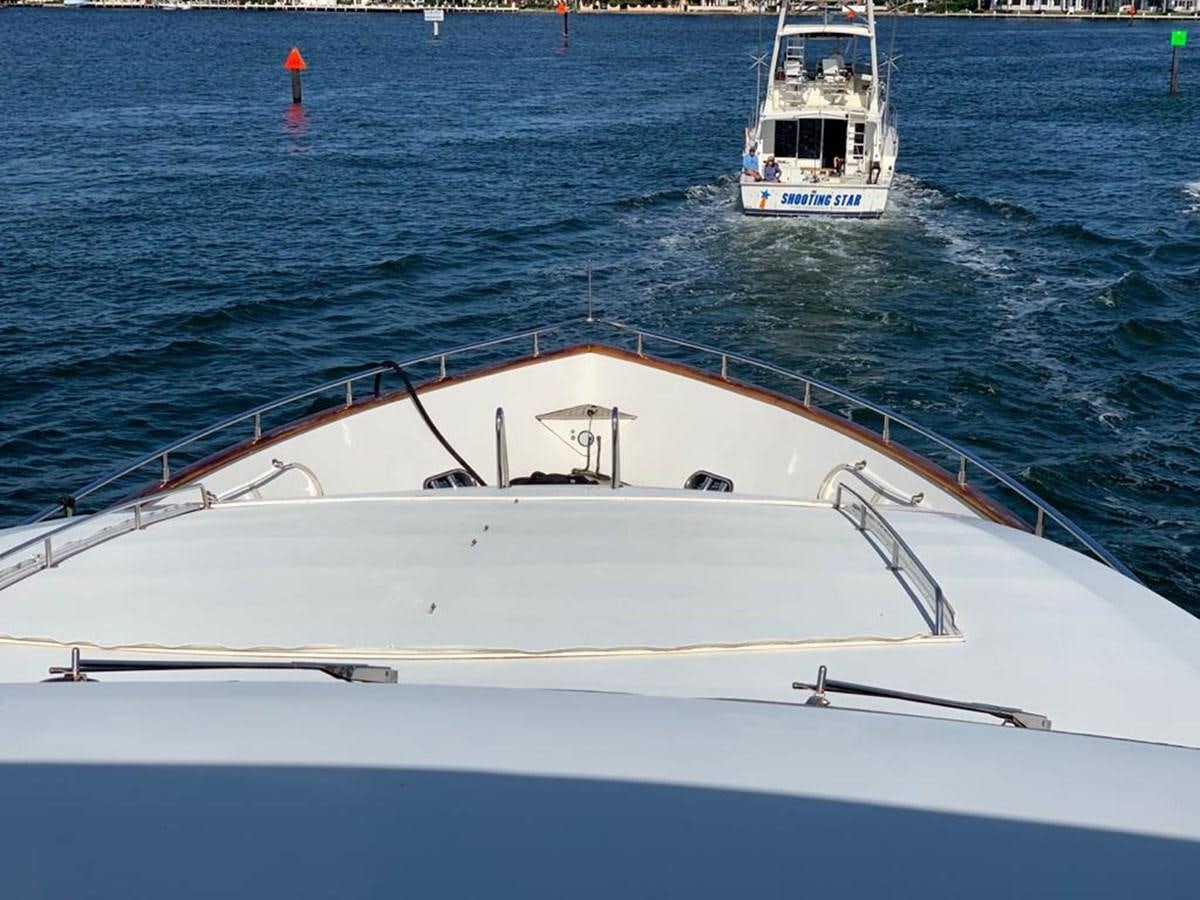 a white boat in the water aboard CAROBELLE Yacht for Sale