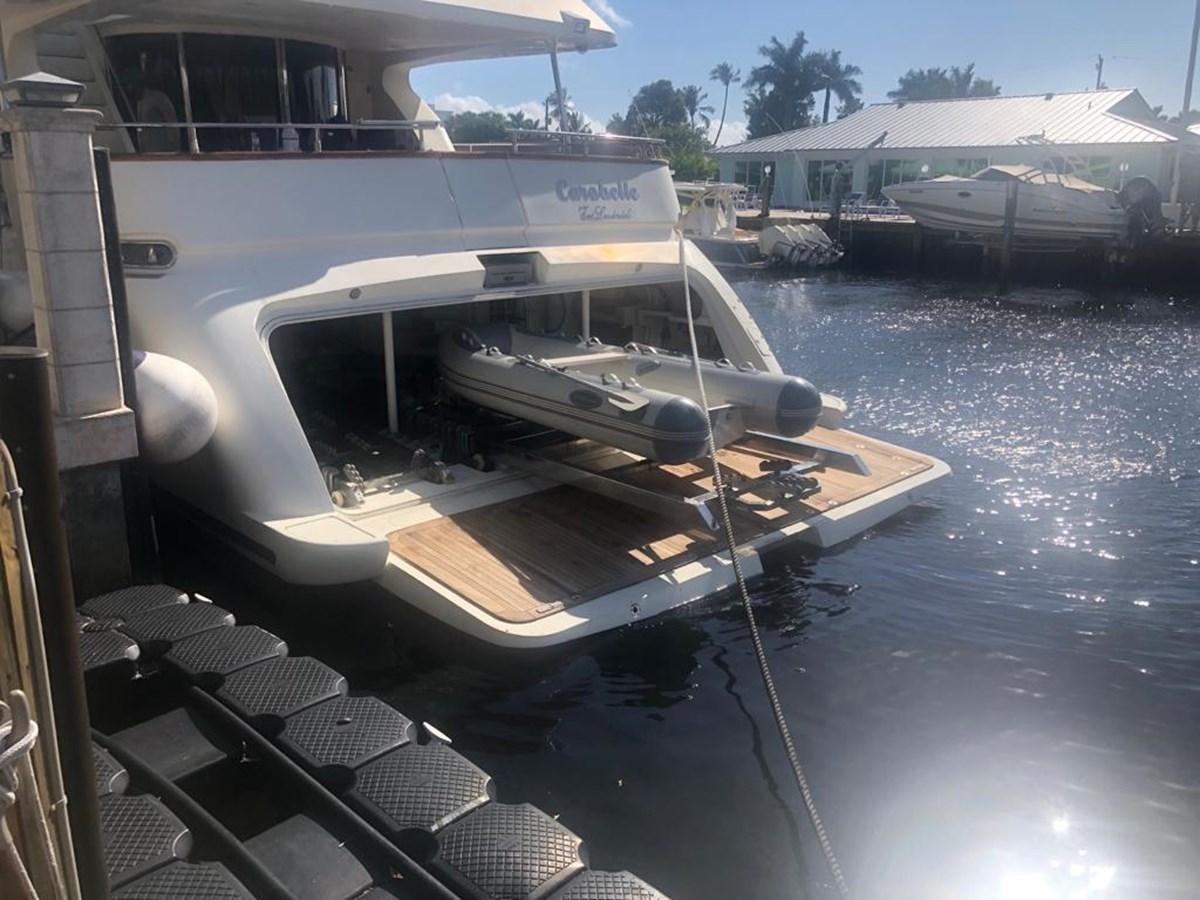 a boat is parked on the side of a river aboard CAROBELLE Yacht for Sale