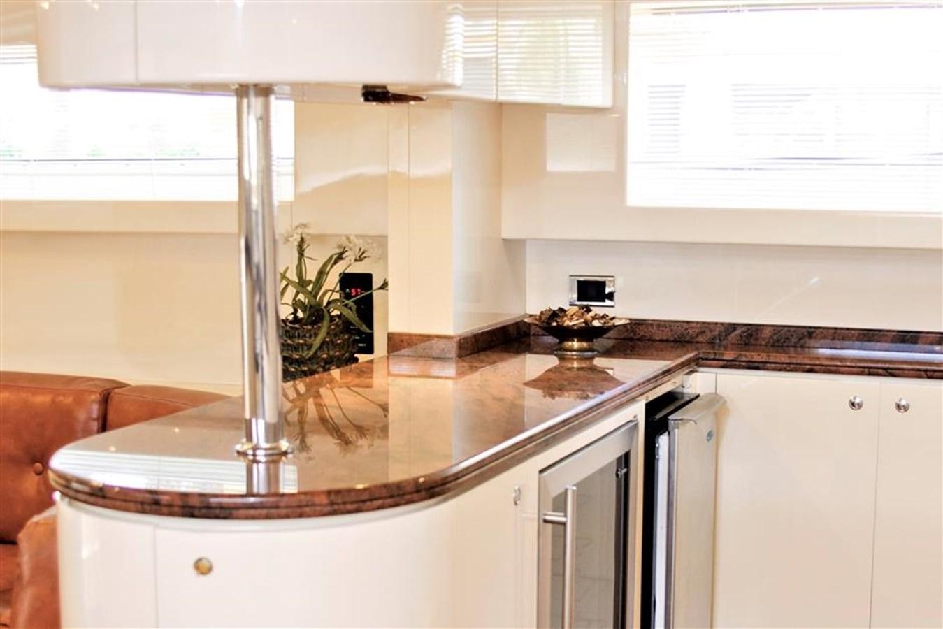 a kitchen with a plant on the counter aboard CAROBELLE Yacht for Sale