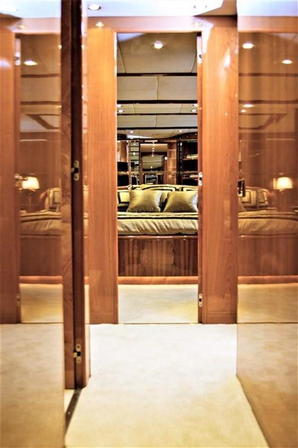 a room with a couch and a mirror aboard CAROBELLE Yacht for Sale
