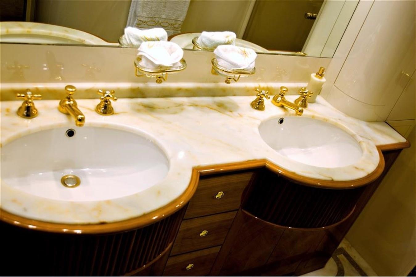 a bathroom with two sinks aboard CAROBELLE Yacht for Sale