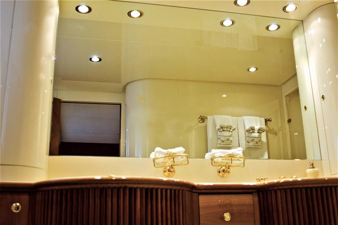 a bathroom with a large mirror aboard CAROBELLE Yacht for Sale