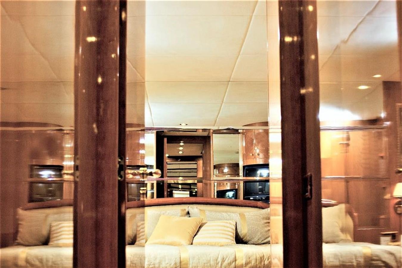 a room with a bed and a shelf aboard CAROBELLE Yacht for Sale
